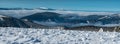 View to Krkonose and Kralicky Sneznik mountains from Vysoka hole hill in winter Jeseniky mountains in Czech republic Royalty Free Stock Photo