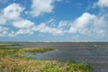 View to the lagoon, lake. Blue sky, water, sand dunes