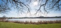 view to lake Egglburger See, oak tree branches without leaves above Royalty Free Stock Photo