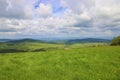 A view to the landscape with mountains, forests and meadows Royalty Free Stock Photo