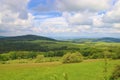 A view to the landscape with mountains, forests and meadows Royalty Free Stock Photo