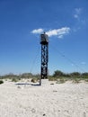 View to the lighthouse on a beach on Kinburn Spit, Mykolaiv oblast Royalty Free Stock Photo