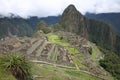 View to the lost Incan City of Machu Picchu with Tourists near Cusco. Peru