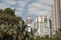 View to the Menara Tower or KL tower through the palm trees of the KLCC park Royalty Free Stock Photo