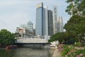 View to the modern buildings and the old Cavenagh bridge in Singapore, Singapore.