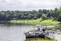 View to Nemunas river with tourist cruise ship and embankment in Druskininkai. Lithuania. Druskininkai is resort with