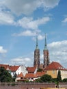 View to the neo-gothic cathedral and colourful houses from embankment in Wroclaw in bright summer day