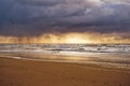 View to the ocean at sunset. Cloudy sky and illuminated horizon. North Holland dune reserve, Egmond aan Zee, Netherlands Royalty Free Stock Photo