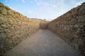 View to old stone blind alley. Architecture of ancient civilization. Masada paths and passages, Israel. Labyrinth dead-end. Royalty Free Stock Photo