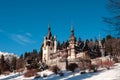 View to the Peles Castle during the winter season. Sunny day and clear sky. Romania, Sinaia. Royalty Free Stock Photo