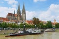 View to Regensburg cathedral and historical buildings with Danube river at the foreground in Regensburg, Germany.