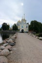 View to the road and entrance gate of Nilov Monastery on Stolobny Island, lake Seliger, Ostashkov, Russia Royalty Free Stock Photo