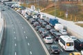 A view to a road with plenty of cars standing at traffic jam on