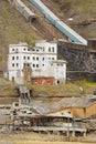 View to the ruined coal mine in the abandoned Russian arctic settlement Pyramiden, Norway.