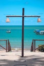 View to the sea with a cross lamp at Praia do Forte, Brazil