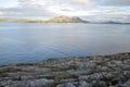 View to the sea and mountains in Torget island in BrÃÂ¸nnÃÂ¸y, Nordland on summer evening Royalty Free Stock Photo