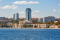 View to the shore of Bosforus strait on an early autumn day. Residential buildings and skyscrapers along the shore and Dolmabahce