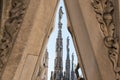 View to spires and statues on roof of Duomo in Milan Royalty Free Stock Photo