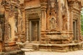 View to the stone carving at the walls of the ruins of the Preah Ko Temple in Siem Reap, Cambodia. Royalty Free Stock Photo