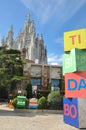 View to Temple Sacred Heart of Jesus and blocks with letters of red, blue, green and yellow colors. Amusement park Tibidabo in Bar