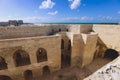 View to the 15th-century defensive fortress Citadel of Qaitbay with no people around, located on the Mediterranean sea coast, in A Royalty Free Stock Photo