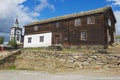 View to the traditional wooden house and church bell tower of the copper mines town of Roros in Roros, Norway.