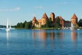 View to the Trakai castle and Galve lake with boats in Trakai, Lithuania.