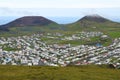 View to two volcanoes and the town of Heimaey on Icelands island , which has the same name Royalty Free Stock Photo