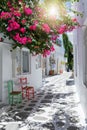 View to the typical small alleys with white houses and colorful flowers at the cycladic town of Parikia, Paros Royalty Free Stock Photo