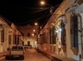 View to typical street with one story buildings at night in bright light of lanterns, Santa Cruz de Mompox, Colombia, World Royalty Free Stock Photo