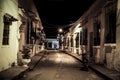 View to typical street with one story buildings at night in light of lanterns, Santa Cruz de Mompox, Colombia, World Heritage Royalty Free Stock Photo