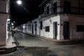 View to typical street with one story buildings at night in light of lanterns, Santa Cruz de Mompox, Colombia, World Heritage Royalty Free Stock Photo