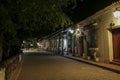 View to typical street with one story buildings at night in light of lanterns, Santa Cruz de Mompox, Colombia, World Heritage