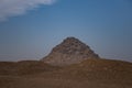 View to Userkaf pyramid from ruins near step pyramid of Djoser. Archeological remain in the Saqqara necropolis, Egypt