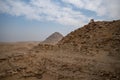 View to Userkaf pyramid from ruins near step pyramid of Djoser. Archeological remain in the Saqqara necropolis, Egypt