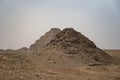 View to Userkaf pyramid with Step pyramid of Djoser at background. Archeological remain in the Saqqara necropolis, Egypt