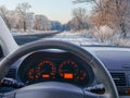 View to the winter road through the car windshield Royalty Free Stock Photo