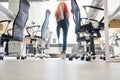 View to woman moving along office room through transparent glass wall Royalty Free Stock Photo