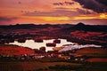 View To Zernosecke Jezero Lake And Lovos Hill From Radobyl Hill In CHKO Ceske Stredohori Tourist Area After Sunset In Czech Summ