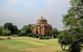 View of the old tomb of the Mughal period - Sheesh Gumbad in the Lodi Garden Park in Delhi, India