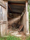 View of the tools and assorted objects in a rustic and very deteriorated small shed