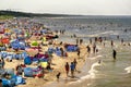 The view from the top of the beach in the summer, crowds of tourists sunbathe Royalty Free Stock Photo