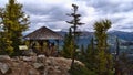 View of the top of Big Beehive mountain in Banff National Park in the Canadian Rocky Mountains with wooden shelter and tourists.