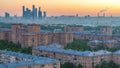 View from top of cityscape timelapse, residential buildings, park areas, group of Moscow City skyscrapers in distance Royalty Free Stock Photo