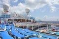 View on top deck with sunbeds and swimming pool on Crown Princess ship Royalty Free Stock Photo