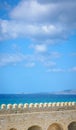 View of the top of the fortress wall in Crete, the sea and the island in the distance