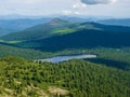 View from the top of the green valley and Lake Svetloye in the Ergaki Nature Park