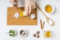 View from top on hands preparing homemade cosmetics from ingredients Royalty Free Stock Photo