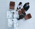 View from the top.the handshake business partners at a business meeting Royalty Free Stock Photo