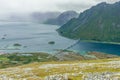 View from the top of Kleppstadheia mountain to the bay with turquoise water, and Rystad and bridge highway between two islands,